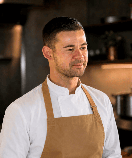 Chef stood in a kitchen