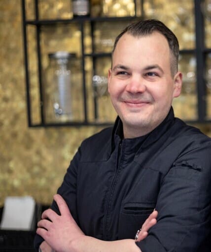Chef stood in kitchen
