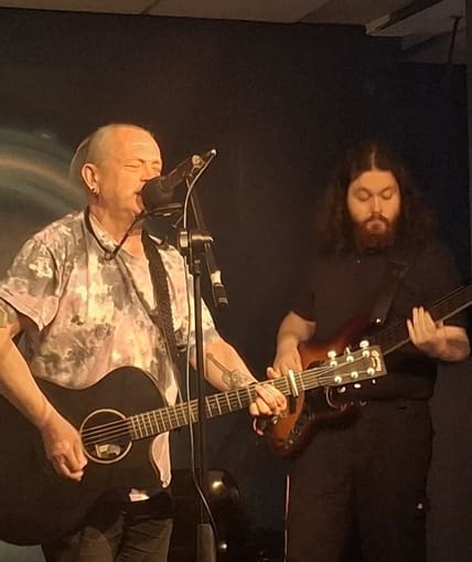 Two musical performers on stage